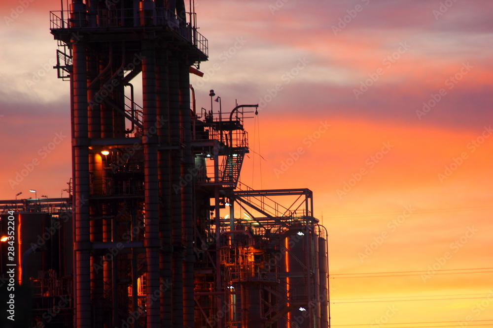 Oil and gas industrial,Oil refinery plant form industry with sunset or Twilight cloudy sky background,Thailand 