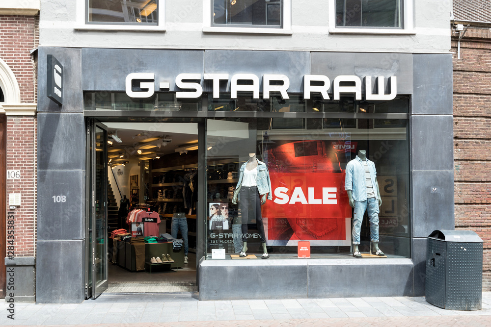 LEIDEN, THE NETHERLANDS - June 23, 2018: G-Star RAW store. G-Star RAW is a  Dutch designer clothing company, founded in Amsterdam in 1989, which  produces urban clothing. Stock Photo | Adobe Stock