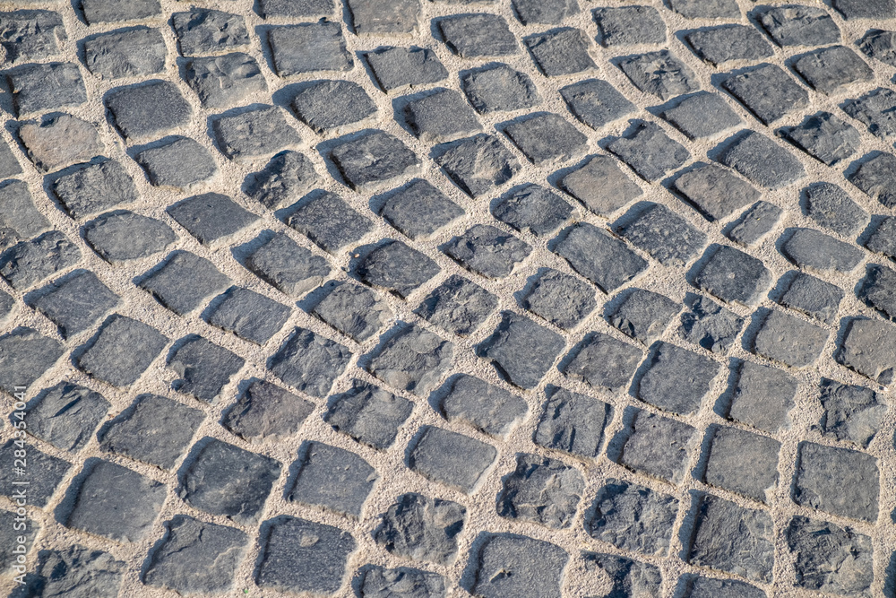Cobbled stone pavement in grey colours Cobbled stone pavement in grey colours