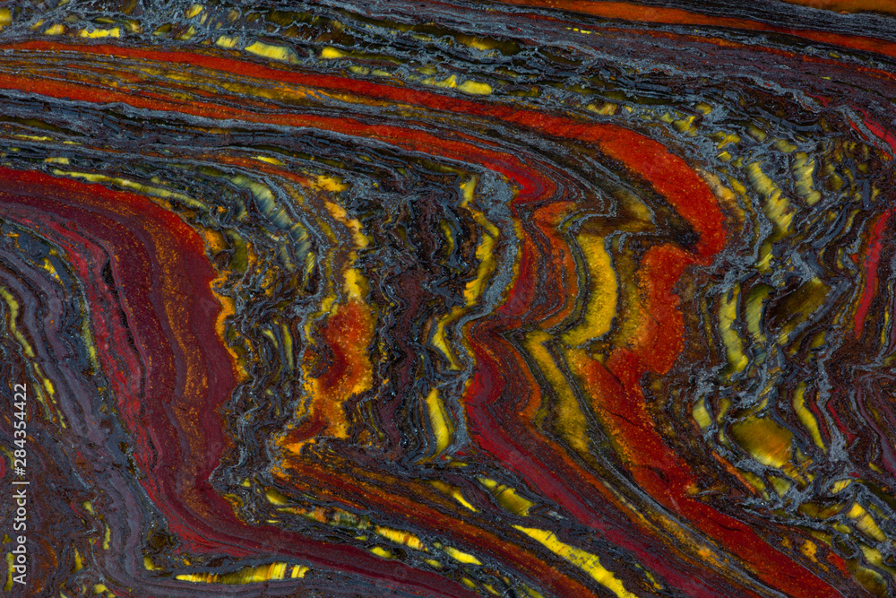 Tiger Iron in red, yellow, blue Tiger Iron in red, yellow, blue