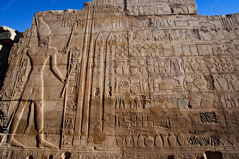 Ancient hieroglyphs on wall, Temple of Karnak, located at modern day