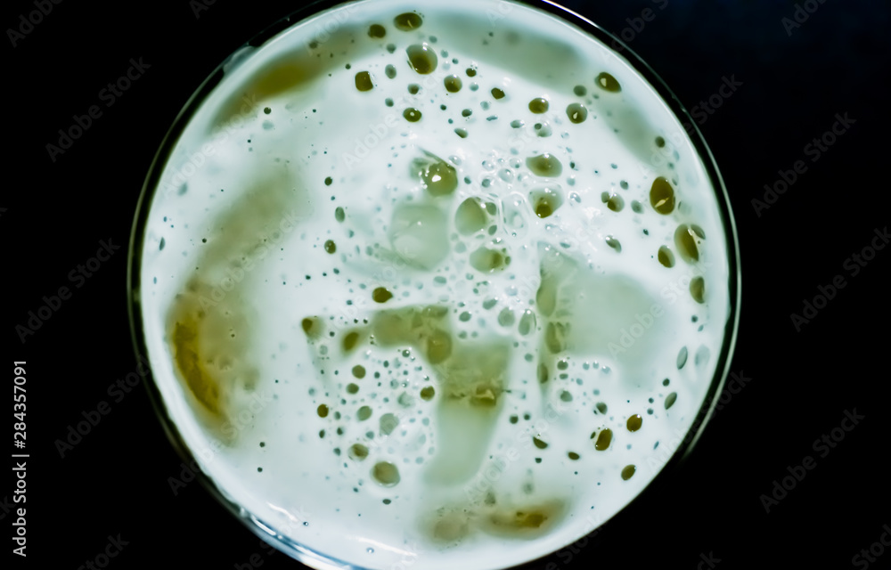 Beer foam and ice on black background Beer foam and ice on black background