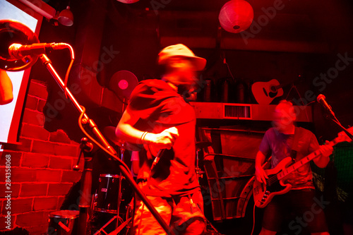 Photography Musicians performing their music in city center night club bar
