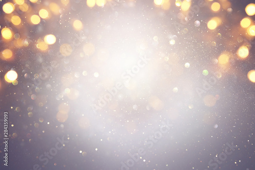 blackground of abstract glitter lights. silver and gold. de-focused