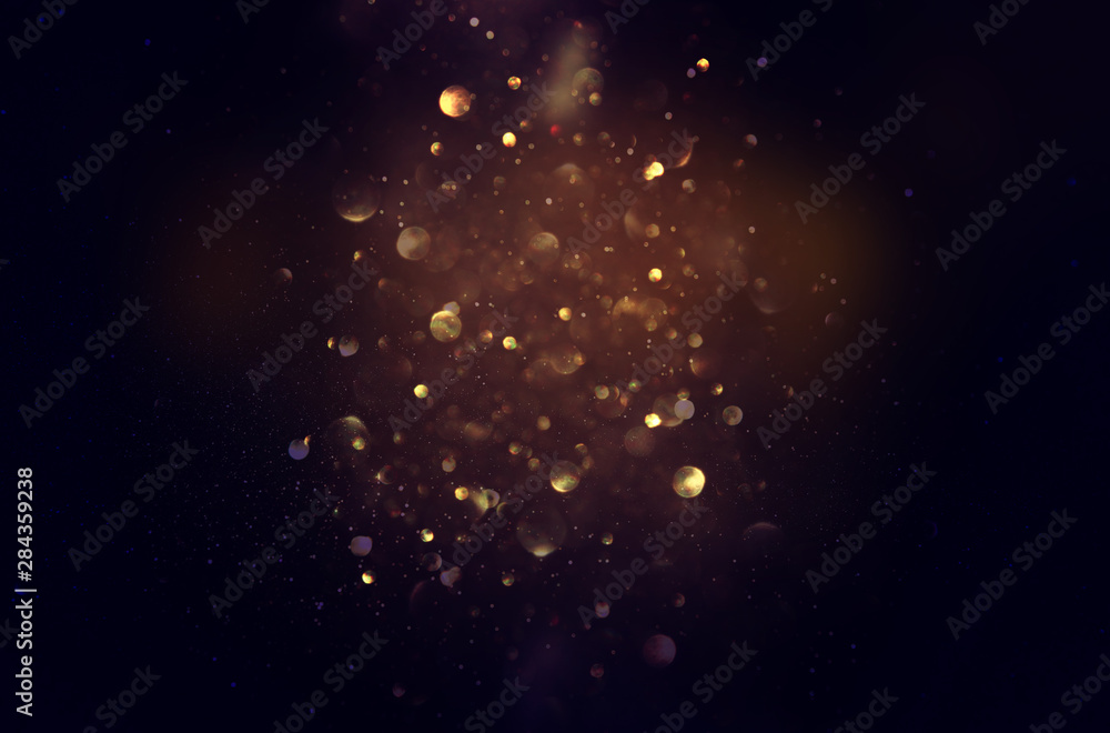 blackground of abstract glitter lights. blue, gold and black. de focused - obrazy, fototapety, plakaty 