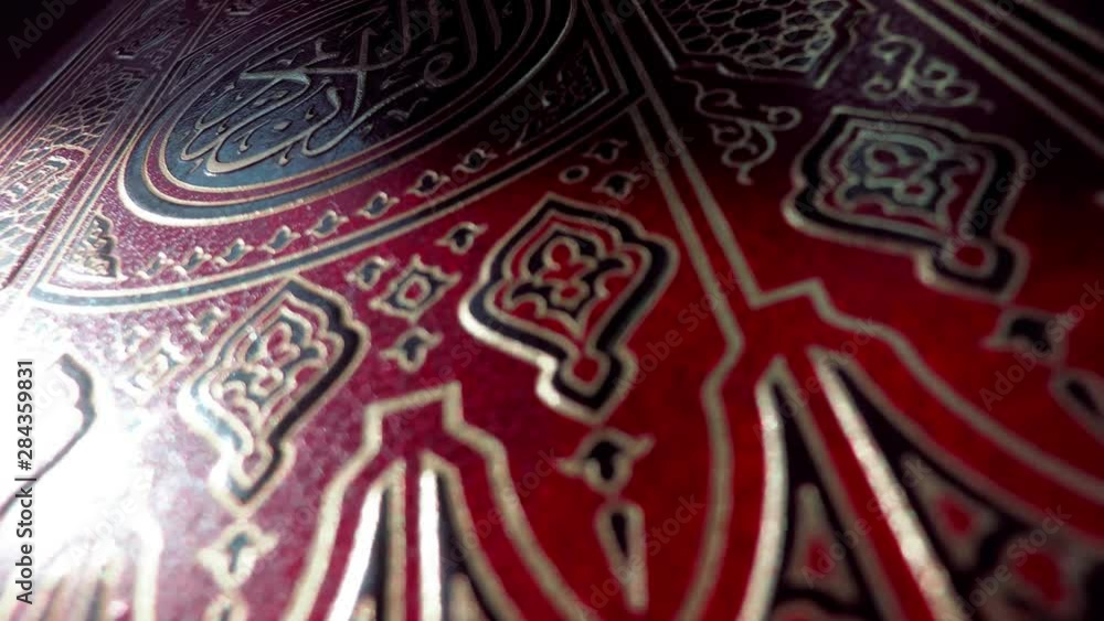 Islam. Religion. Quran on a dark background, close-up. Islam. Religion. Quran on a dark background, close-up.