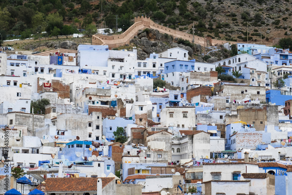 Morocco, Chefchaouen. Houses pack in tightly within the walls of the medina.