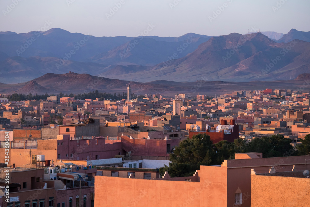 Morocco. The village of Tinerhir is bathed in the warm light of sunrise.