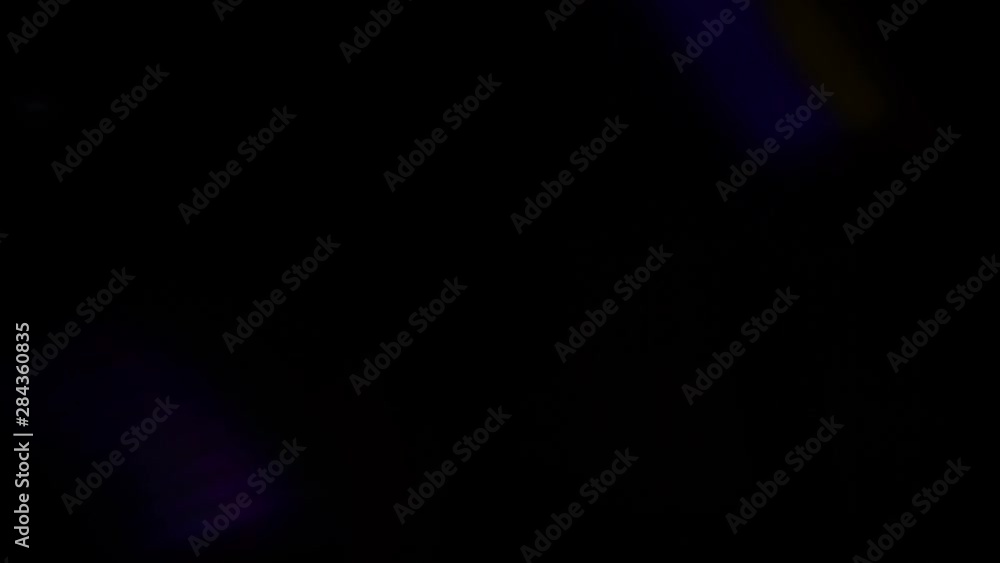 Real Lens Flare Shot in Studio over Black Background. Easy to add as Overlay or Screen Filter. Blue and gold lights. Real Lens Flare Shot in Studio over Black Background. Easy to add as Overlay or Screen Filter. Blue and gold lights.