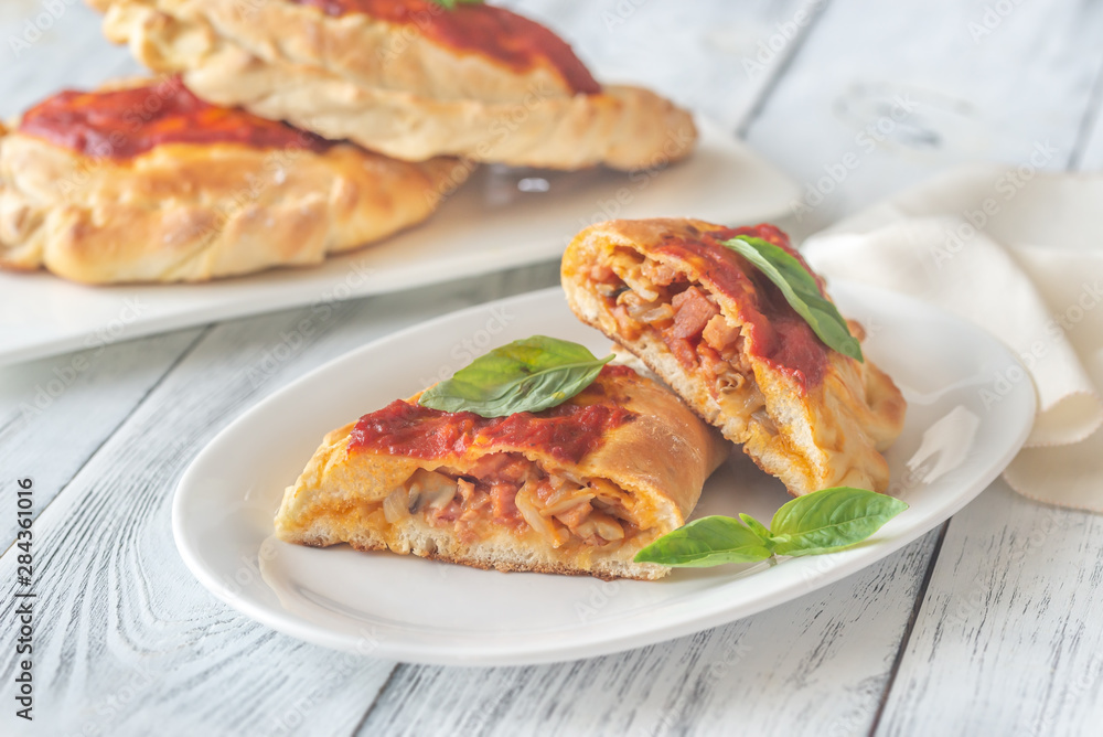 Homemade calzone on the plate Homemade calzone on the plate