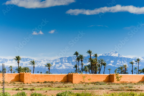 Photography Outside The City Ramparts, High Atlas mountains behind, Marrakech, Morocco