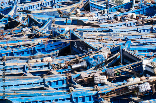 Morocco, Essaouira, small skiff tied in harbor. © Emily Wilson/Danita Delimont