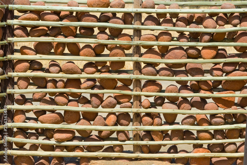 Fence made of stick and stones in a traditional house in Kalahari Desert, Keetmanshoop, Karas Region, Namibia