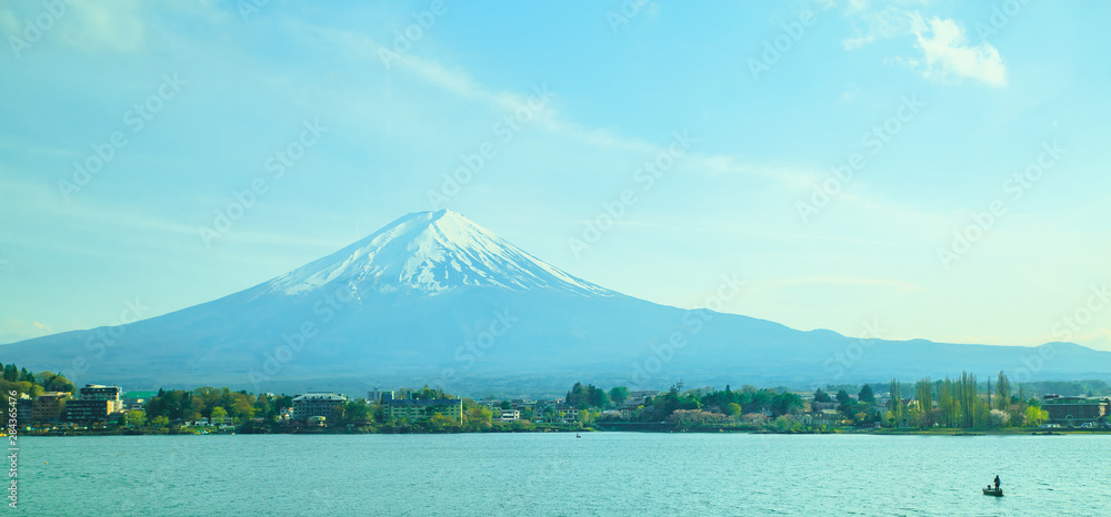 Mt diamond fuji with snow and flower garden along the lake walkway at Kawaguchiko lake in japan, Mt Fuji is one of famous place in Japan. 