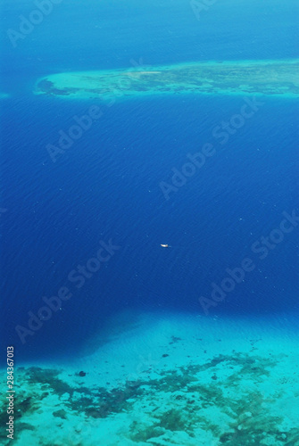 Tanzania, Zanzibar, Stone Town, turquoise aerial view on coral and small islets