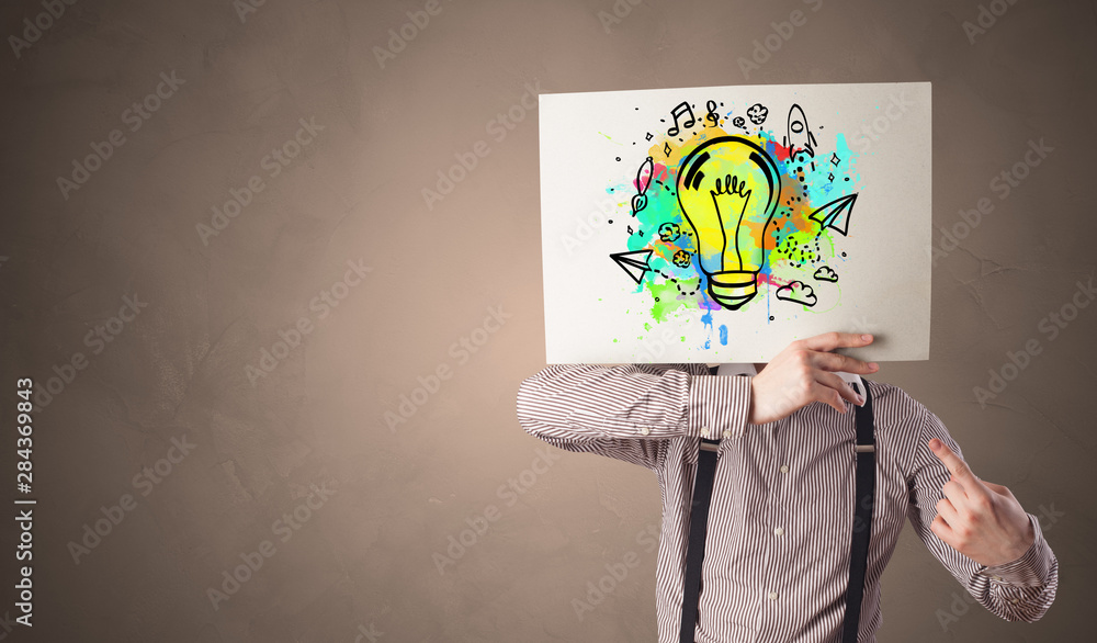 Person holding a paper with a drawn colorful idea concept Person holding a paper with a drawn colorful idea concept