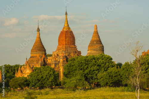 Myanmar. Bagan. Red brick temple glows in the late afternoon light.