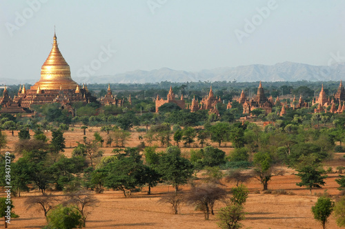 Myanmar, Bagan, Vast arid plain of ancient buddhist temples and bushes