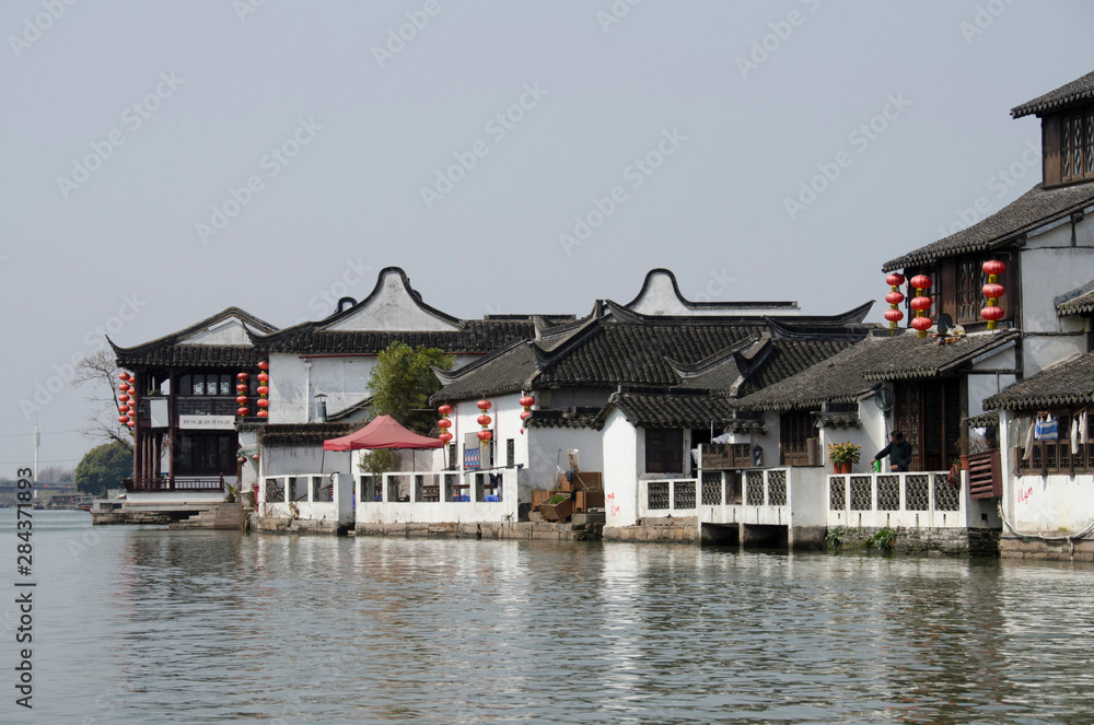 China, outskirts of Shanghai. Ancient water village of Zhujiajiao (AKA Pearl Stream) with a long history dating back over 1,700 years to Qing Dynasty. Typical riverfront homes. China, outskirts of Shanghai. Ancient water village of Zhujiajiao (AKA Pearl Stream) with a long history dating back over 1,700 years to Qing Dynasty. Typical riverfront homes.