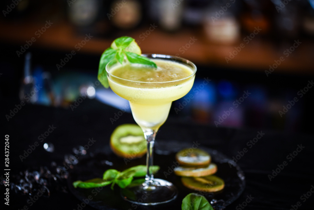 kiwi cooler cocktail with fresh basil & ice kiwi cooler cocktail with fresh basil & ice
