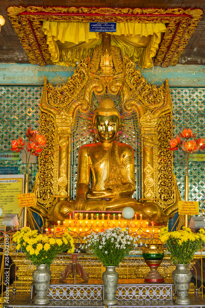 Myanmar. Mandalay. Sagaing Hill. Soon U Pon Nya Shin Paya. Buddha with a shiny gold face.