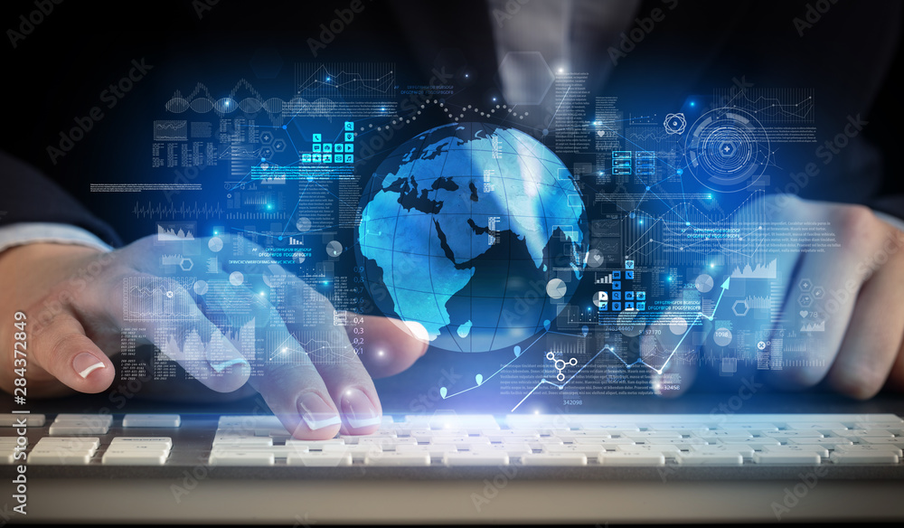 Business woman typing on keyboard with global system concept Business woman typing on keyboard with global system concept