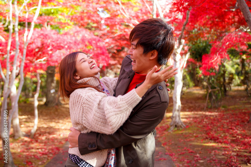 Lover  love  relationship  season  family and people concept. Happy couple in autumn park. Lover gives a big hug. Valentine s day concepts.