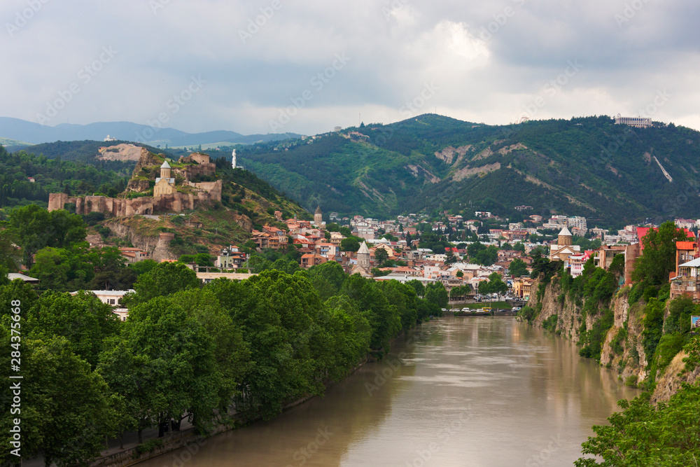 Mt'k'vari (Kura) River flowing through Tbilisi, Georgia.