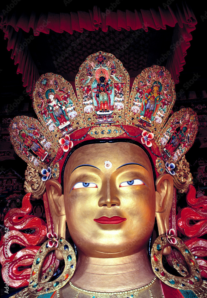 Asia, India, Ladakh, Thikse. The Buddha at Thikse Gompa in Ladakh, India, has an elaborate painted headdress.