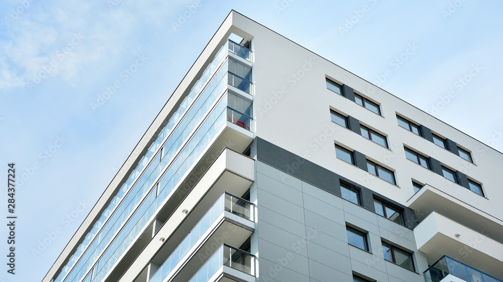 Contemporary residential building exterior in the daylight.  - obrazy, fototapety, plakaty 