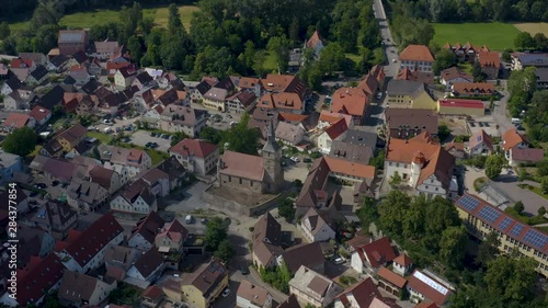 Aerial view of the city Bad Friedrichshall in Germany. Zoom in and tilt down on to the palace and the church. photo