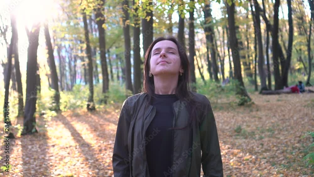 Relaxing breath in the autumn park. Steady shot. Slow motion Relaxing breath in the autumn park. Steady shot. Slow motion
