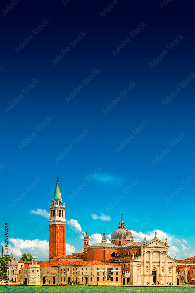 Beautiful Church of San Giorgio Maggiore and its Bell Tower at sunset illumination, Venice, Italy, summer