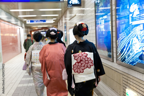 Geishas in subway, Kyoto, Japan