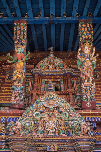 Asia, Nepal, Kathmandu Valley, Patan, multi-armed Hindu goddesses on struts of Minanath Temple © John & Lisa Merrill/Danita Delimont