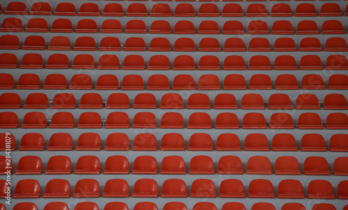 Rows of green empty folding seats