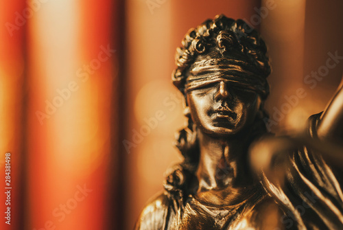 Brass figurine of a blindfolded Justice