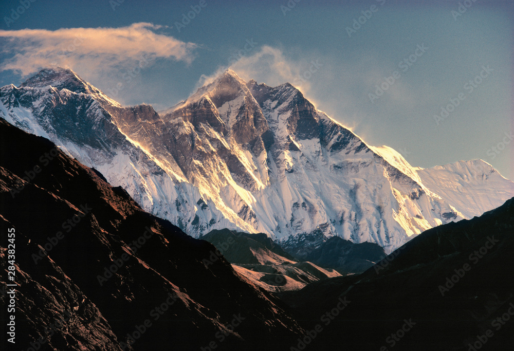 Asia, Nepal, Sagarmatha NP. Fierce winds whip snow off Mt. Everest, on the left, and Lhotse and Nuptse in Sagarmatha National Park, a World Heritage Site, in Nepal.