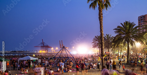 Night scene with many people at the Malagueta beach photo