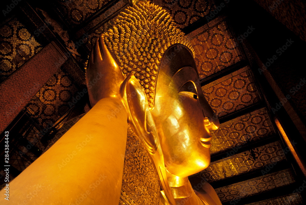 Asia, Thailand, Bangkok. Wat Po, Golden reclining Buddha.