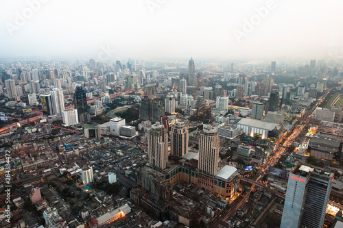 Bangkok, Thailand - The downtown district of a city with smog in the background.
