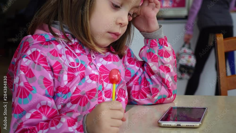 Eating and childhood concepts A little girl a child of 4 5 years old Eating and childhood concepts A little girl a child of 4 5 years old