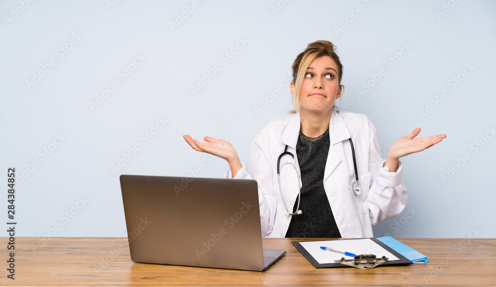 Blonde doctor woman making doubts gesture Blonde doctor woman making doubts gesture