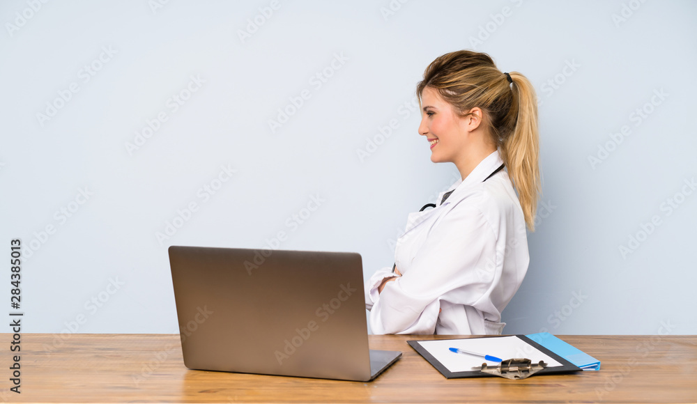 Blonde doctor woman in lateral position Blonde doctor woman in lateral position