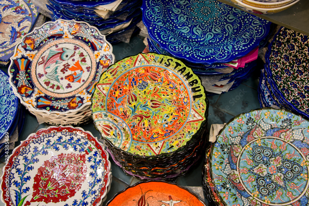 Fototapeta premium Asia, Turkey, Istanbul. Grand Bazaar (aka Kapalicarsi). Hand painted ceramic souvenir plates with colorful ornate designs..