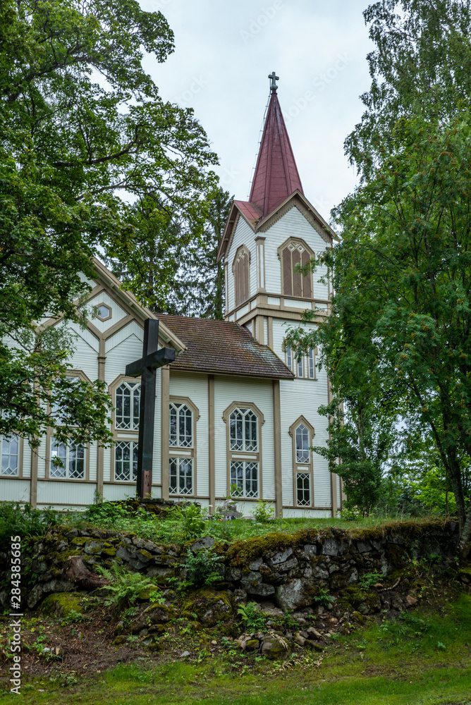 The old wooden church of Enonkoski in Finland  in summer  - 2