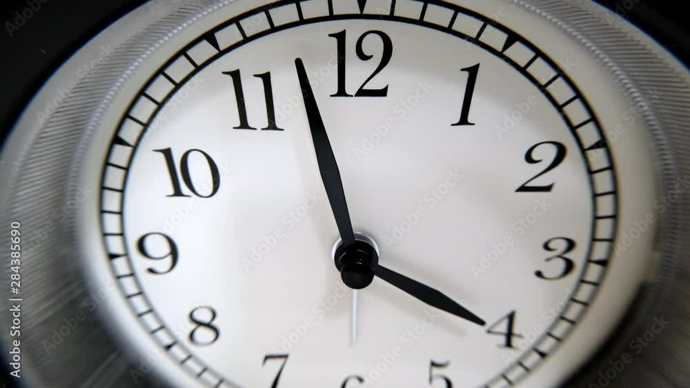The Clock With Black Arrows Shows The Time Four Hours Timelapse. The Clock With Black Arrows Shows The Time Four Hours Timelapse.