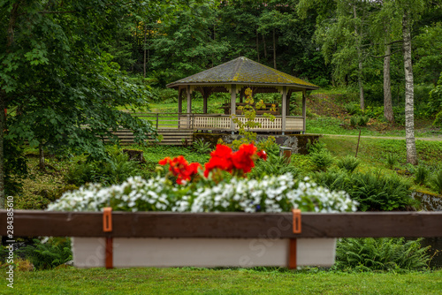 Flowers and gazebo s in a park in Enonkoski in Finland in summer - 1 photo