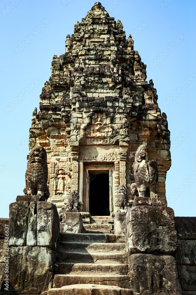 Siem Reap, Cambodia. Spires and statues atop of the Bakong Temple, Pre Rup (Roluos Group)