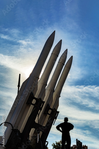 Ground-to-air self-propelled medium-range anti-aircraft missile system to combat maneuvering aerodynamic targets. Missiles of the air defense system on sky background. Military equipment.